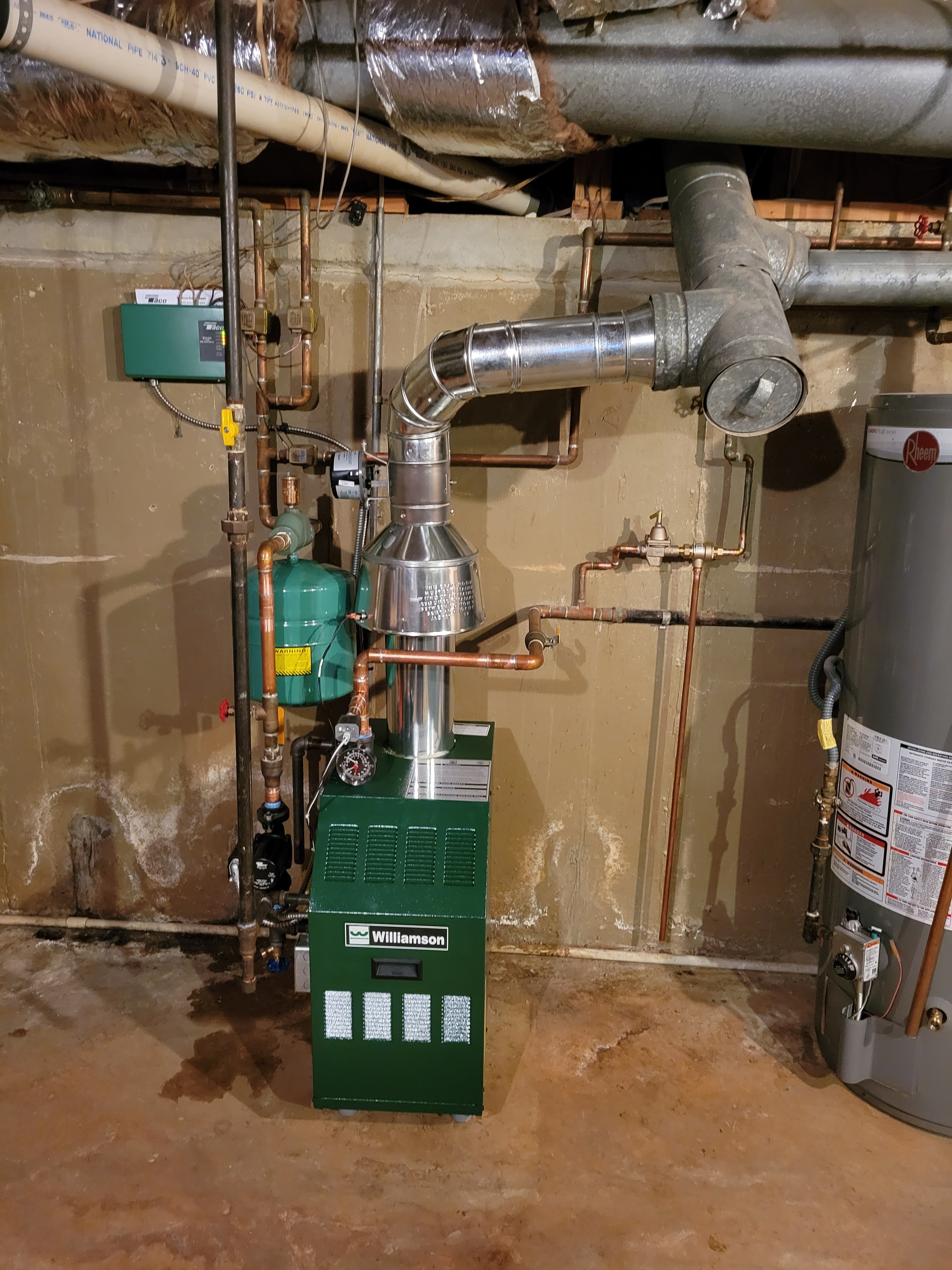 DMES LLC boiler installation with copper piping and hydronic heating components