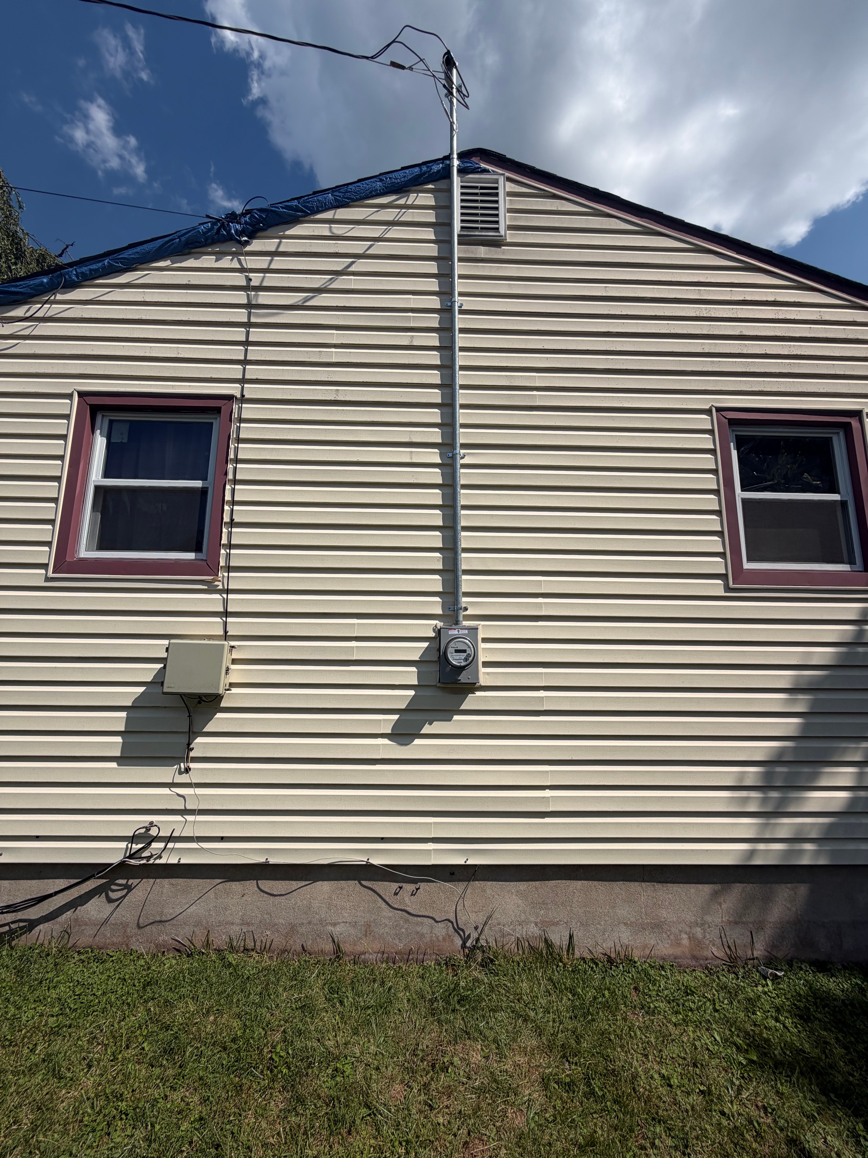 DMES LLC electrical meter and service equipment on building exterior